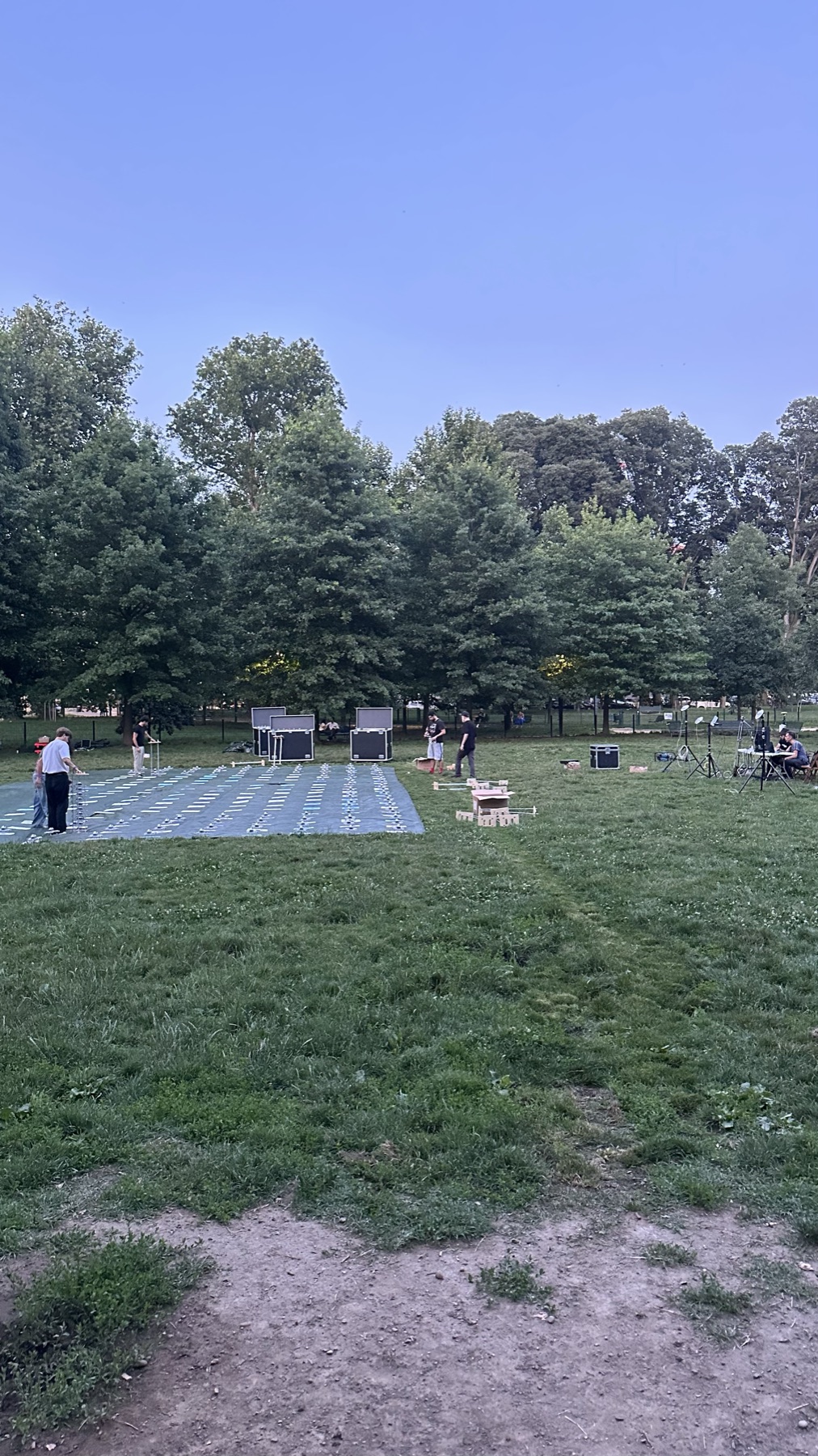 Drones laid out in a grid on the lawn in daylight