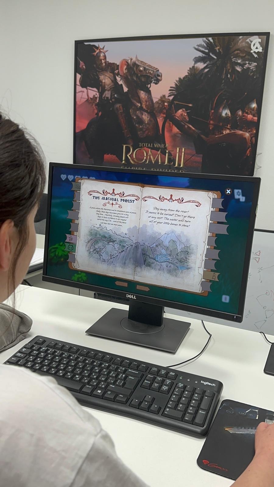 A visitor reading the Magical Forest page of the journal on screen